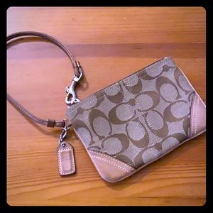 Coach signature C tan wristlet in used condition